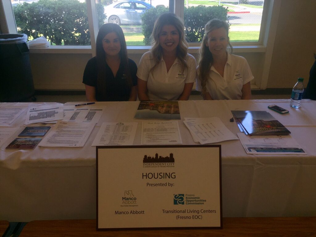 Vendor Booth With Three Staff Members
